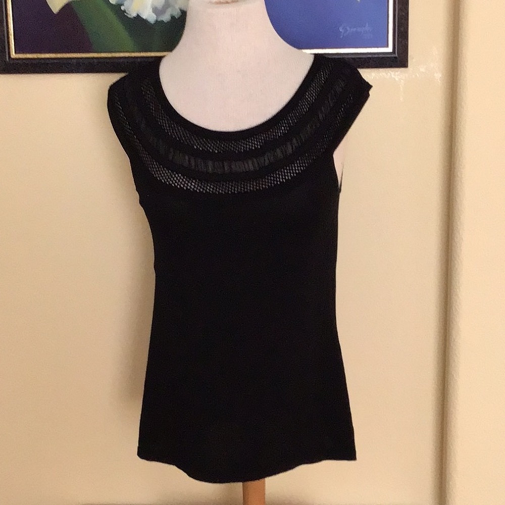 Black sleeveless top.